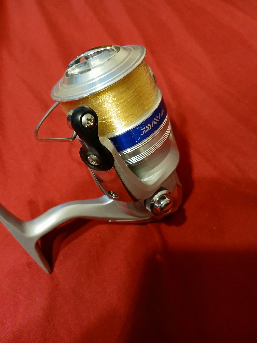 Silver Spinning Reel with Gold Line